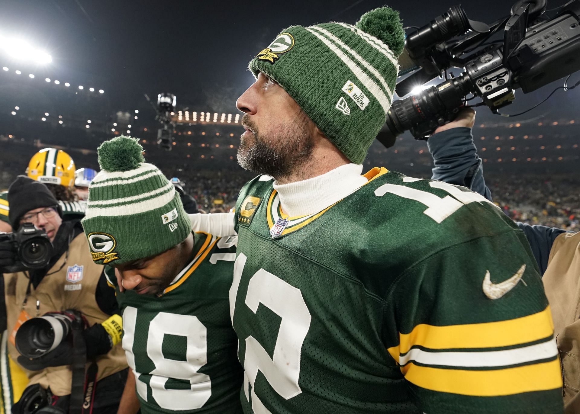 Aaron Rodgers and Randall Cobb of the Green Bay Packers walk off the field